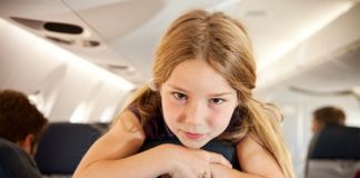 A little girl on a plane