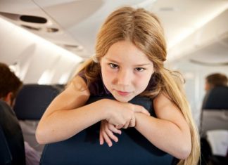 A little girl on a plane