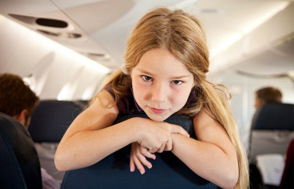 A little girl on a plane