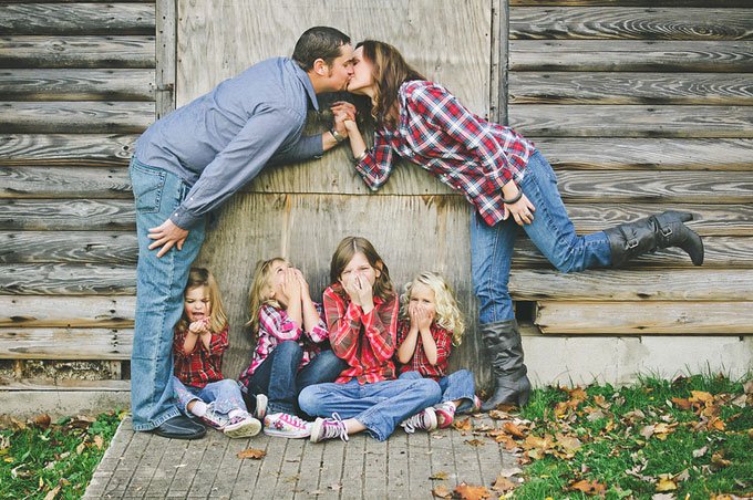 Kissy-Face Ew! Mom and dad are kissing! This is a cute pose with kids giggling at their parents being affectionate. SHINE ON PHOTOGRAPHY