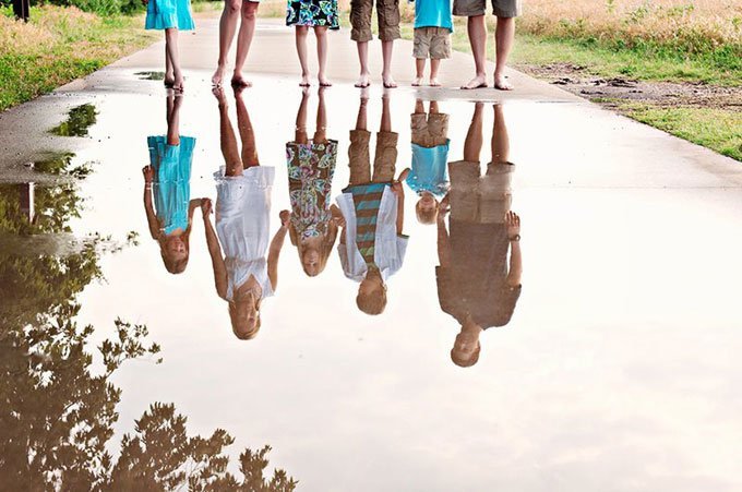Reflections Capture your family's reflection in still water for a unique and interesting photograph. LIZLABIANCAPHOTOGRAPHY.COM