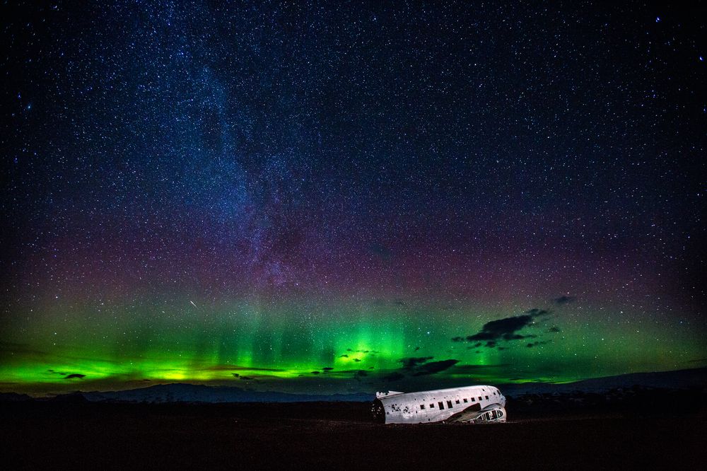 Auroras and DC-3 in the South of Iceland Photograph by Carlos Gauna